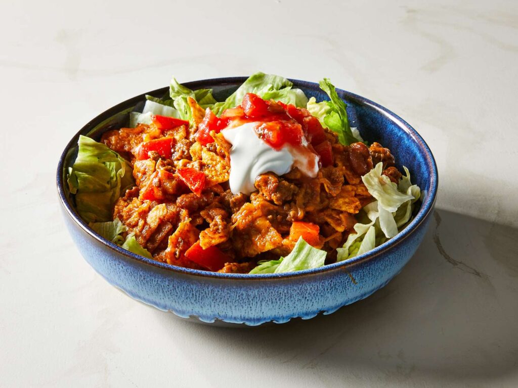 Mexican Green Salad with Corn, Red Beans, Lettuce, Tomatoes, and Sausage